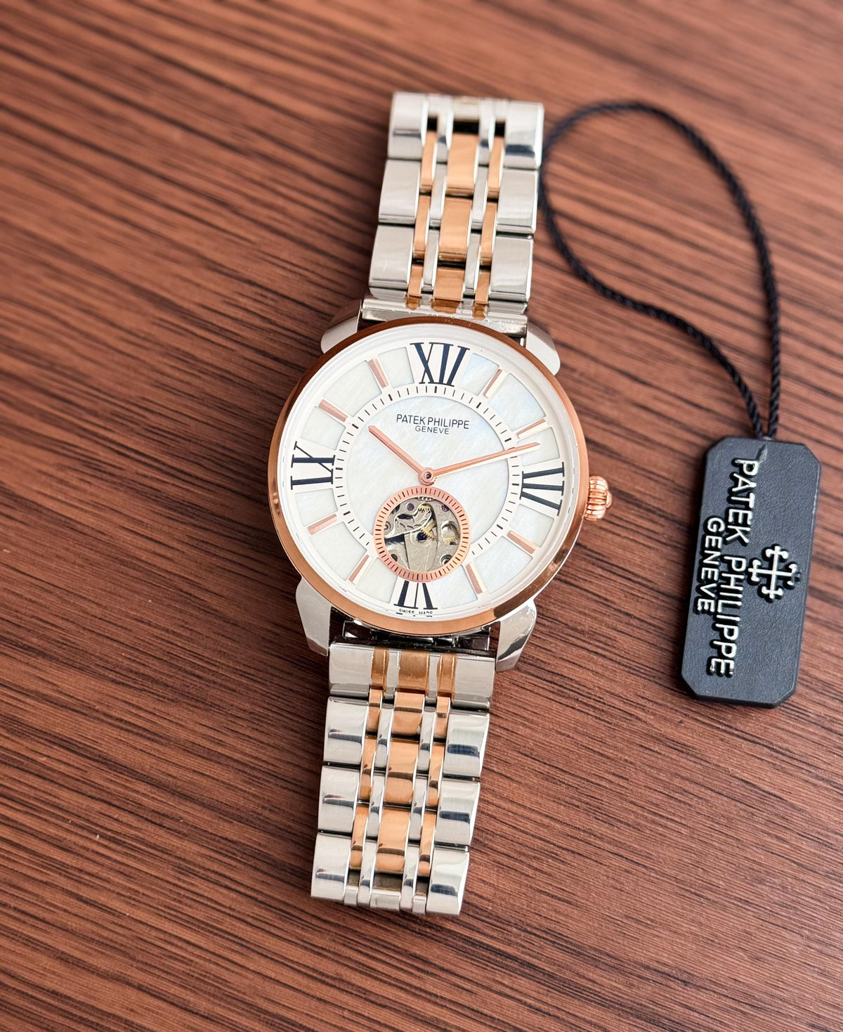 PATEK PHILIPPE MEN'S AUTOMATIC OPEN HEART WATCH – TWO TONE BRACELET WITH ROMAN DIAL